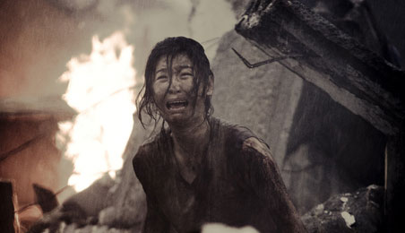 A girl with injuries, crying having lost her everything in storm